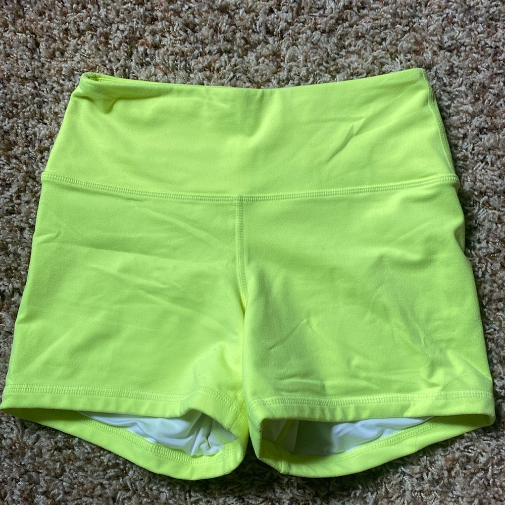 Bright yellow Fleo shorts size small.